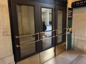 Bank of doors with heritage brass push bars