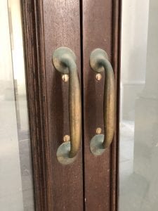 Close up of brass door pulls