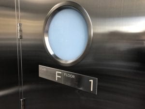 Stainless steel door with round door lite