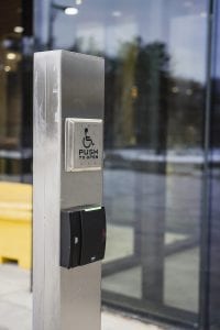 Stainless steel bollard with pushbutton and card reader