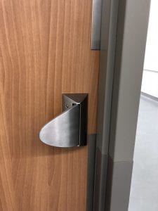 Close up of Sargent hospital latch on wood door