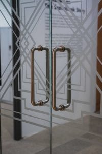 Door pulls on pair of glass doors