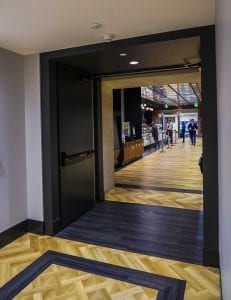 Cross corridor opening with black hardware