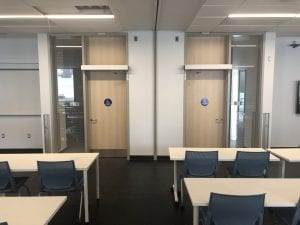 Wood transom doors in college classroom
