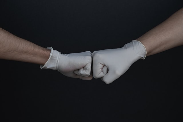 fist bump with gloves on